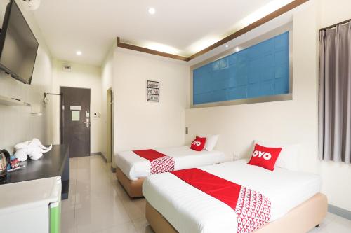 Krevet ili kreveti u jedinici u okviru objekta Korat Buri Green Hotel