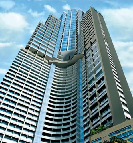 a large tall building with a sculpture of a bird at City View at The Gramercy Residences in Makati