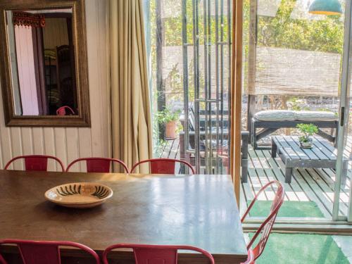 a table with a bowl on top of it on a patio at Casa Campo Lindo in Olmué