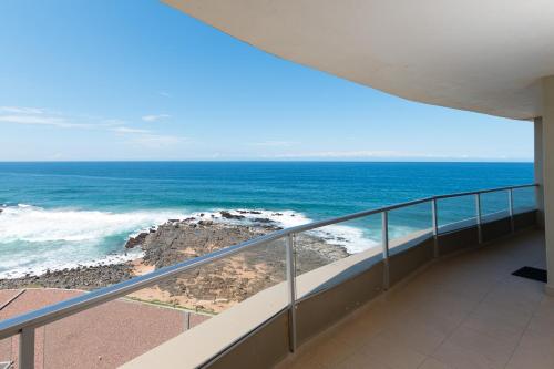 a view of the ocean from a balcony at The Boulders 503 in Ballito