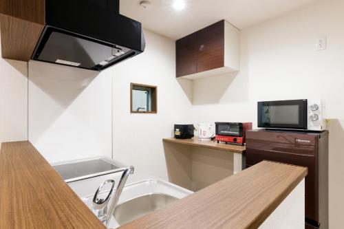 Dapur atau dapur kecil di Crescent Moon Nakanoshimbashi