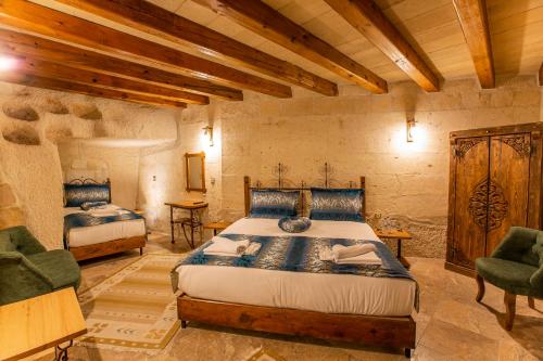 Ένα ή περισσότερα κρεβάτια σε δωμάτιο στο Goreme Mansion