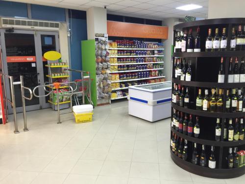 a store filled with lots of bottles of wine at HOTEL Apartments ARDO in Golem