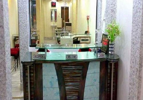 a bathroom with a sink and a mirror at Hotel Raj Inn Ajmer Sharif in Ajmer