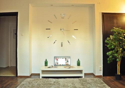 a large clock on a wall in a room at Hotel Raj Inn Ajmer Sharif in Ajmer