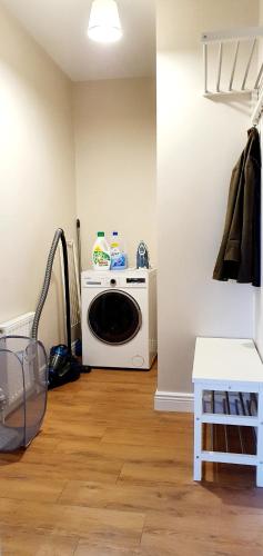 a living room with a microwave oven in a room at Riverside Marina Apartments in Lanesborough