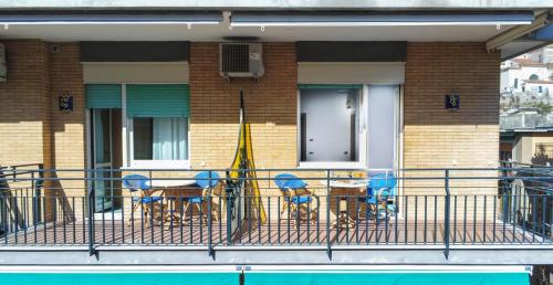 a balcony with a table and chairs on a house at La Casa Delle Stelle in Maiori