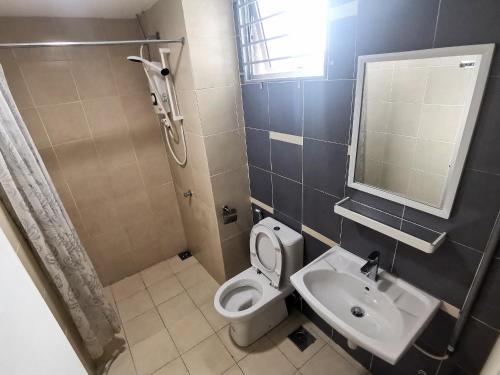a bathroom with a toilet and a sink and a shower at A's House i-City 1-4pax Studio Netflix Wifi in Shah Alam