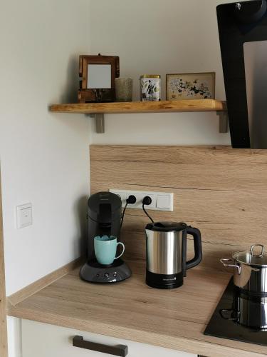 a coffee maker on a shelf in a kitchen at Heeser Hof - Urlaub im Grünen in Weeze