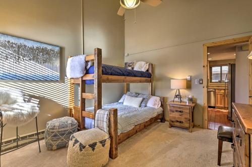 a bedroom with two bunk beds and a desk at Steamboat Ski Getaway with Balcony and Resort Views! in Steamboat Springs