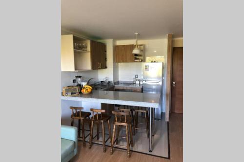 Kuchyň nebo kuchyňský kout v ubytování Departamento en Edificio Costanera Playa Villarrica