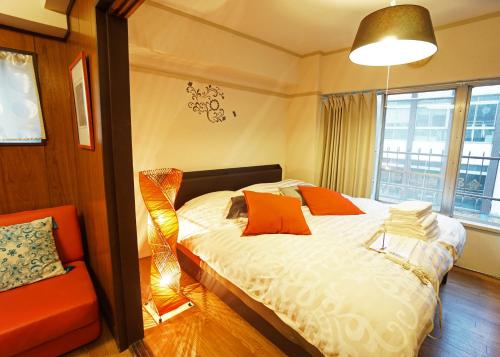 מיטה או מיטות בחדר ב-Yokohama Classic Apartment