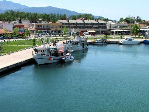 a group of boats docked in a marina at Joy Apartment in Keramotí