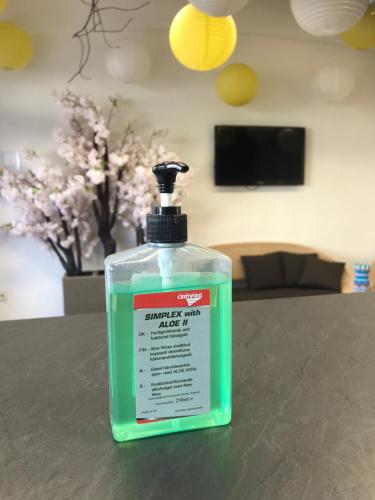 a bottle of mouthwash sitting on a table at OASIS Teplice in Teplice