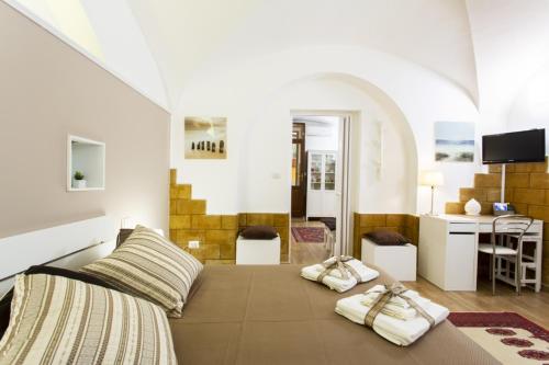 Krevet ili kreveti u jedinici u okviru objekta Palermo Central Holiday