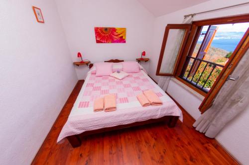 Postel nebo postele na pokoji v ubytování Kuca Kata - Property Nono