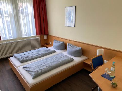 Postel nebo postele na pokoji v ubytování Münchner Hofbräu Coburg
