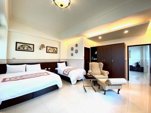 Postel nebo postele na pokoji v ubytování Ho Feng Private Hotel 電梯自助民宿