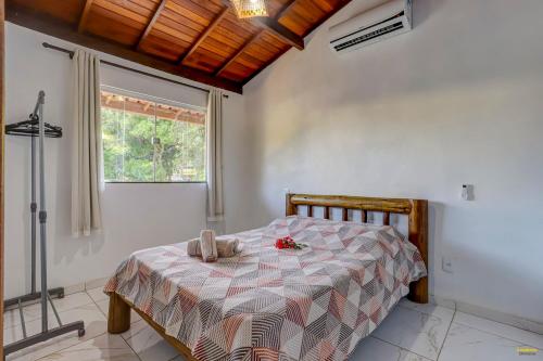 Cama ou camas em um quarto em Pousada Residenzial Cariocare