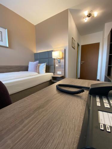 Ένα ή περισσότερα κρεβάτια σε δωμάτιο στο Hotel in den Herrnwiesen