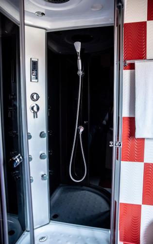 a shower in the back of a vehicle at Casa Robi in Peştişani