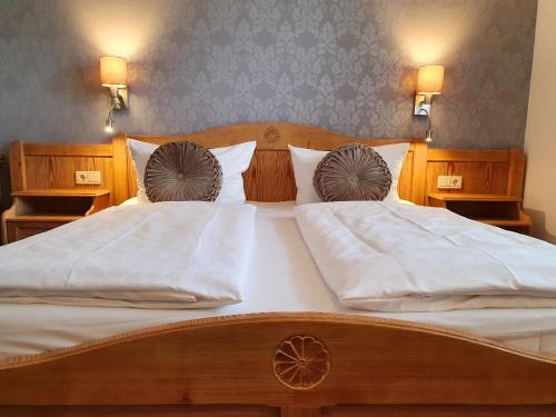 Ένα ή περισσότερα κρεβάτια σε δωμάτιο στο Hotel in den Herrnwiesen