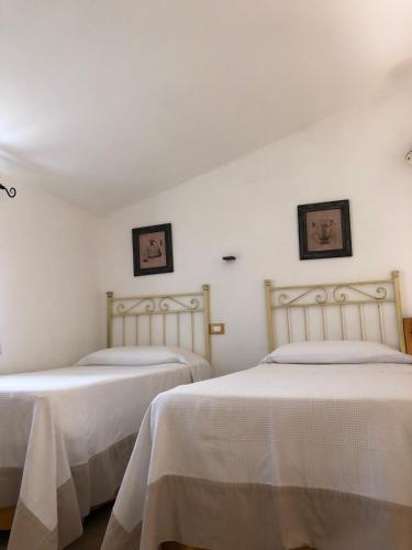 Postel nebo postele na pokoji v ubytování Masseria La Chiusa Delle More