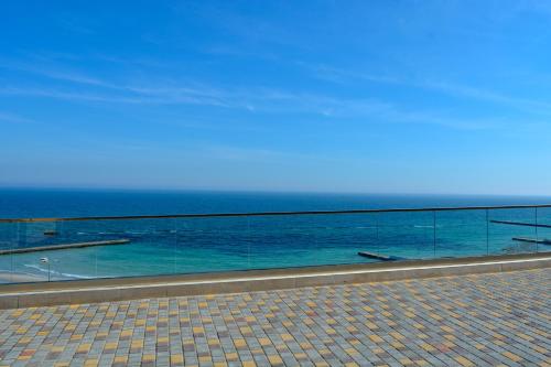a view of the ocean from a walk way at Chayka Resort in Odesa