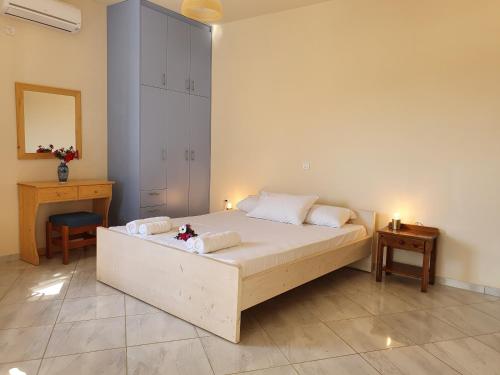 A bed or beds in a room at Stoupa Lefktro 5
