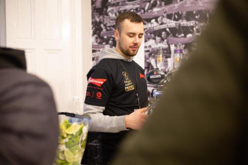 a man is standing in a wine shop at Hotel Anfield in Liverpool