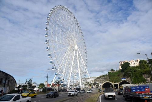 a large ferris wheel in the middle of a street at Pompeu Rio Hotel in Rio de Janeiro