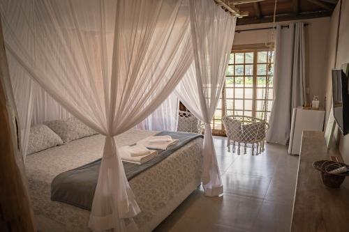 מיטה או מיטות בחדר ב-Vila Gaia Guest House