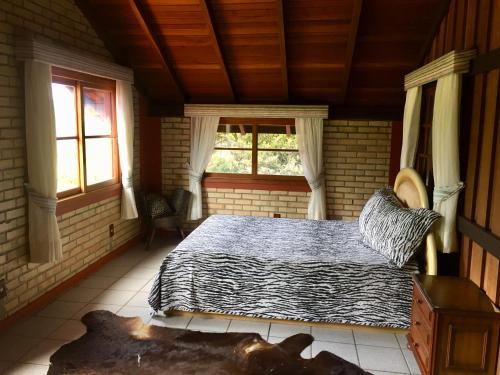 Ein Bett oder Betten in einem Zimmer der Unterkunft Haras Central do Marchador - Casa de campo