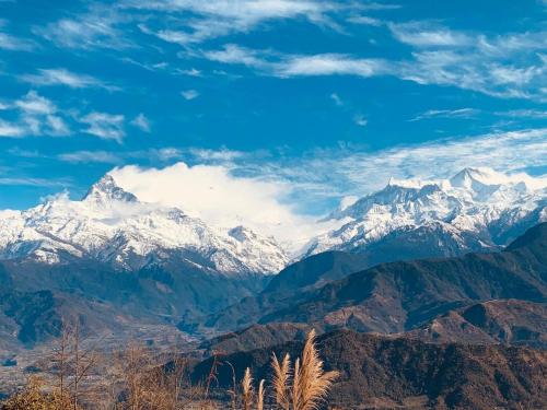 a view of a mountain range with snow at Hotel Pristine Himalaya in Pokhara