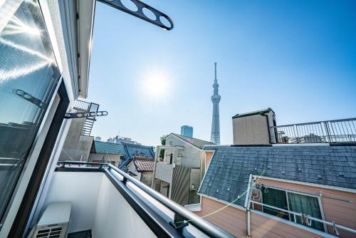 a balcony with a view of the eiffel tower at Tachibana in Tokyo