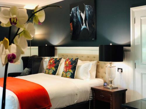 A bed or beds in a room at The Dudley Boutique Hotel