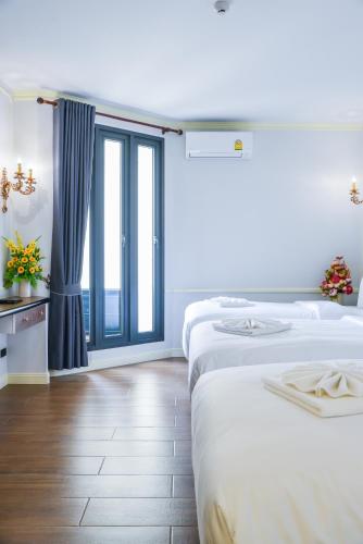 Ein Bett oder Betten in einem Zimmer der Unterkunft The MACEO Hotel