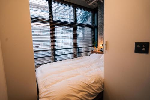 Katil atau katil-katil dalam bilik di mizuka Daimyo 4 - unmanned hotel -