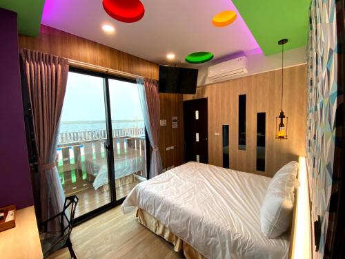 Cama o camas de una habitación en 奧斯卡海景民宿Oscar Boutique Seaview Homestay