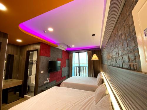 Cama o camas de una habitación en 奧斯卡海景民宿Oscar Boutique Seaview Homestay