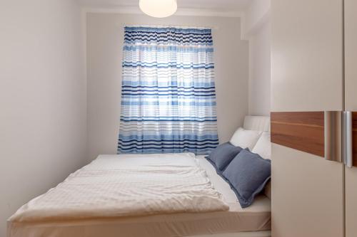 Apartments Rina tesisinde bir odada yatak veya yataklar