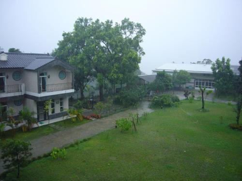 an aerial view of a house and a yard at Feng Lin Homestay in Shuili