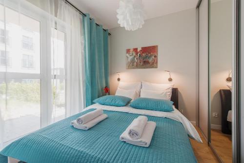 Posteľ alebo postele v izbe v ubytovaní Wagonowa P&O Apartments