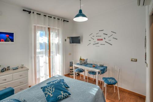 a bedroom with a bed and a desk in it at Casa di Flo in Sorrento