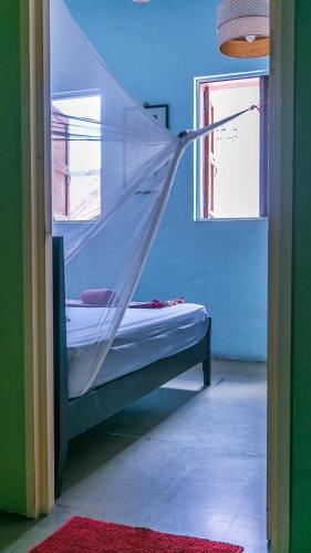 Una cama o camas en una habitación de Voyage Guesthouse