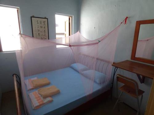 Una cama o camas en una habitación de Voyage Guesthouse