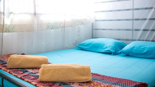 Una cama o camas en una habitación de Voyage Guesthouse