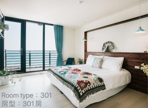 Chuanfanrock Haku Beach Days Innにあるベッド