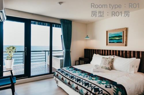 Chuanfanrock Haku Beach Days Innにあるベッド