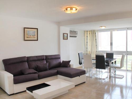 a living room with a couch and a table at Apartment Coblanca III in Benidorm